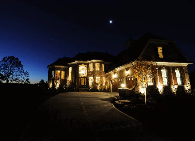 luxury house with outdoor lighting in Apex