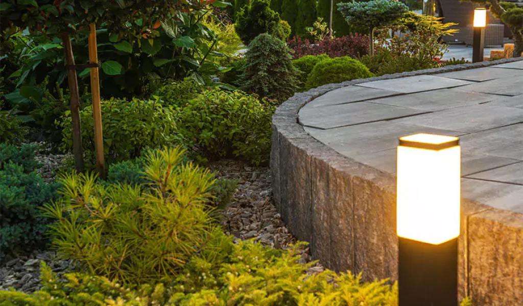 Landscape Lighting installed into beautiful green plants